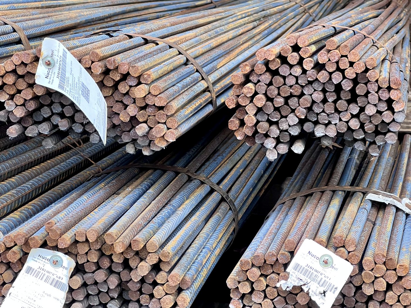Bundles of black Grade 60 and Grade 80 rebar with Nucor mill tags in stock at RC Supply Corp in Freeport NY